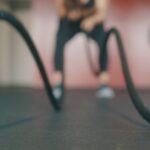 person holding black exercise rope