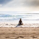 woman sitting on seashore