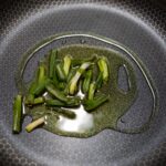 green vegetable on stainless steel round plate