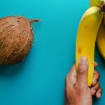 yellow banana fruit beside brown coconut fruit