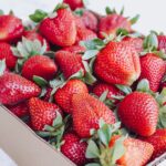 strawberries in white cardboard box