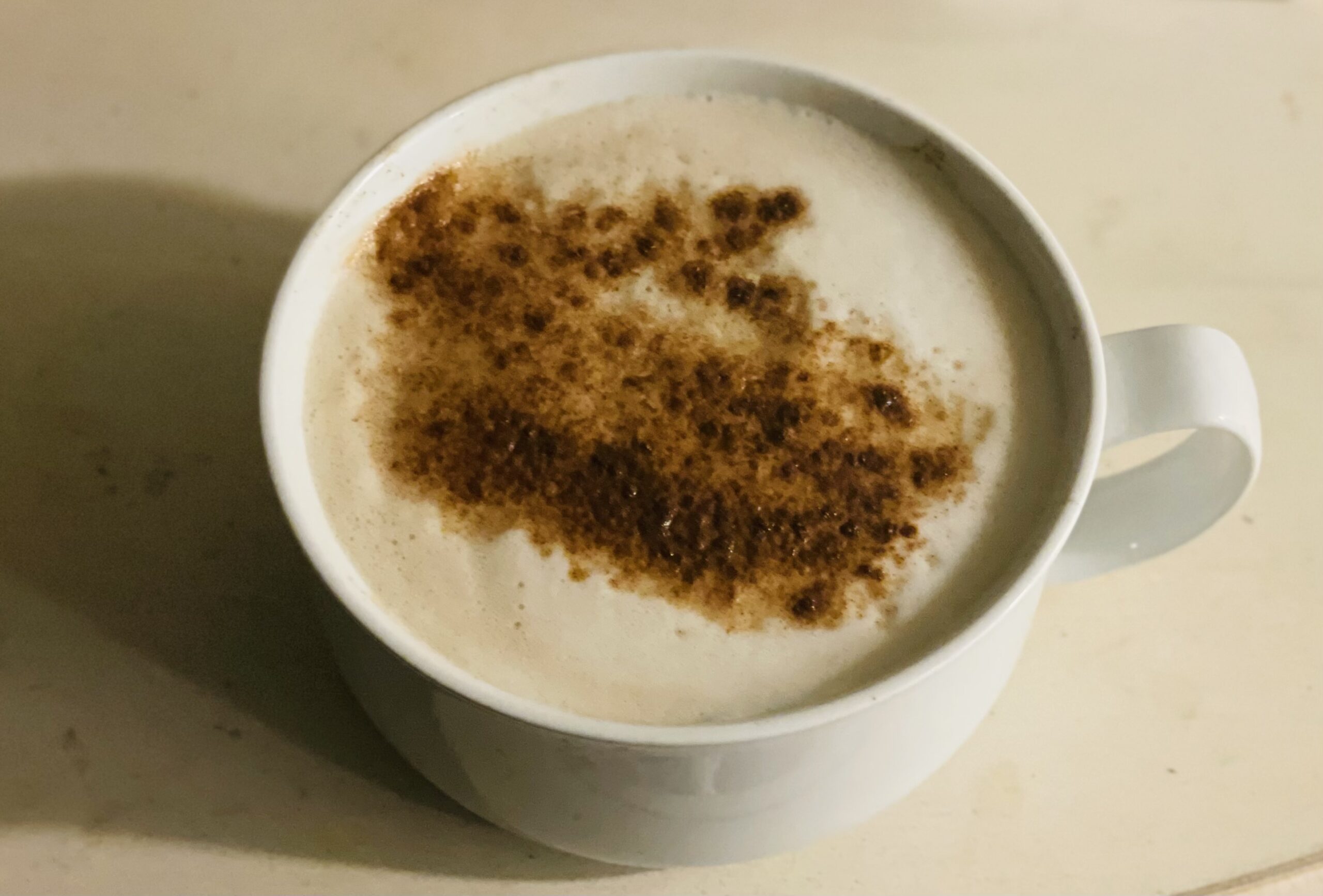 The ultimate self-care. A foamy salted caramel latte sprinkled with cinnamon in the morning