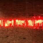 lighted eat what makes you happy neon signage