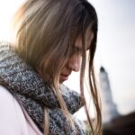 woman wearing gray and black scarf