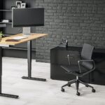 black flat screen computer monitor on brown wooden desk